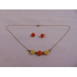 9ct gold and carved coral necklace and a pair of matching earrings, approx total weight 2.8g