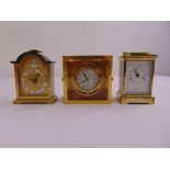 A Halcyon Days desk chronograph, a brass mounted carriage clock and a miniature bracket clock (3)