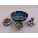 A quantity of Iznik style pottery to include a large bowl, a vase and two dishes (4)