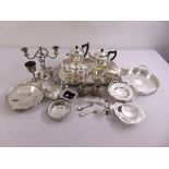 A quantity of silver plate to include trays, dishes, condiments and candlesticks