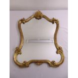 An Art Nouveau style gilded wooden wall mirror
