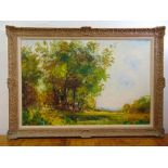 A framed oil on canvas of a country landscape indistinctly signed bottom right, 61 x 91.5cm