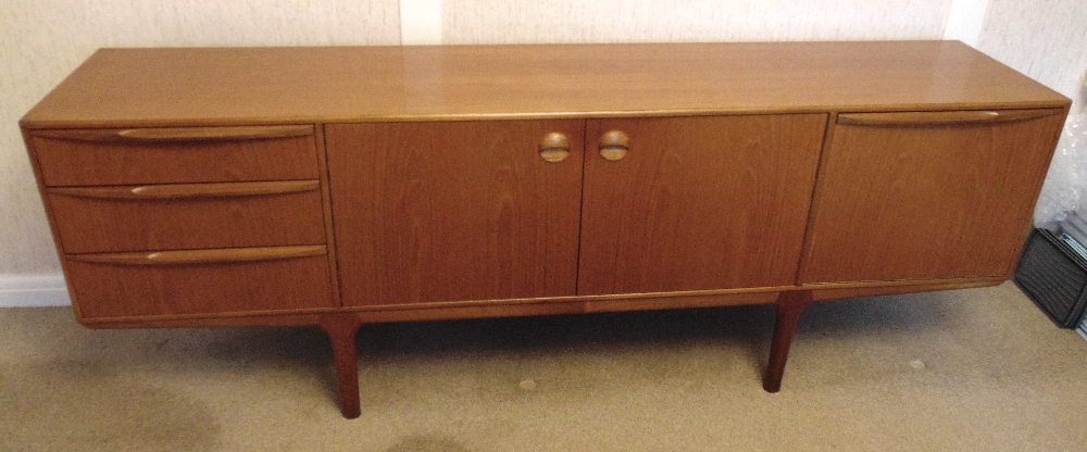 McIntosh & Sons teak rectangular sideboard with drawers and cupboards on four tapering rectangular