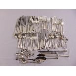 A quantity of silver plated flatware to include knives, forks, spoons and servers