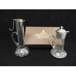 A Victorian Art Nouveau style panelled glass claret jug with silver collar and hinged cover,