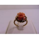 9ct yellow gold and florally carved coral ring, approx total weight 4.1g