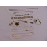 A quantity of costume jewellery to include a bracelet, necklaces and brooches