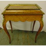 A Kingswood inlaid rectangular jardiniŠre with gilt metal mounts on four cabriole legs