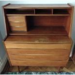 A Danish teak rectangular writing desk with four drawers, fitted interior on four tubular legs