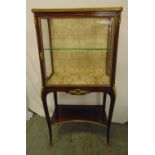 A French style rectangular glazed display case with gilt metal mounts, on cabriole legs, retailed by
