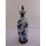 A Chinese blue and white baluster vase converted to a table lamp decorated with butterflies, mounted