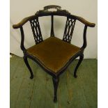 An Edwardian mahogany corner chair with pierced slats, upholstered seat on cabriole legs