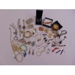 A quantity of costume jewellery to include earrings, necklaces, bracelets and watches