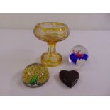 A Caithness paperweight, a John Derain peacock paperweight, a heart shaped paperweight and a