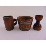 A quantity of treen to include a miniature bucket with silver mounts, a carved mug and a double