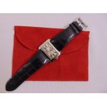 Cartier stainless steel wristwatch on a Cartier leather bracelet