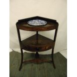 A Victorian mahogany corner unit with single drawers on three outswept legs