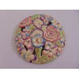 Clarice Cliff My Garden circular wall plaque, pierced and moulded with flower heads, marks to the