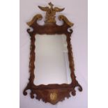 A late 19th century continental mahogany rectangular framed wall mirror with gilded decoration