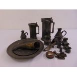 A quantity of pewter to include Irish jugs, French plates, flagons and measures (14)