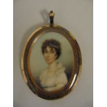 William Thicke framed and glazed miniature of a lady wearing pearls in her hair, the oval copper
