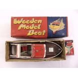 H.M Japan Wooden Model Boat in original packaging, to include outboard motor