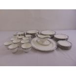 A Royal Worcester Beaufort part dinner service to include plates, a sauce boat on stand, cups,