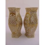 A pair of Bohemian porcelain hexagonal vases with gilded geometric forms to the sides