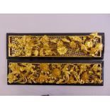 A pair of oriental rectangular gilt wood reticulated panels carved with fauna and flora, each 16.5 x