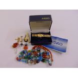 A quantity of costume jewellery to include necklaces, earrings, brooches and a watch