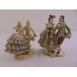 Two continental porcelain figural groups of courting couples in 18th century costume, marks to the