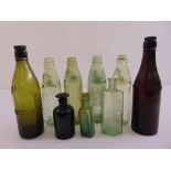 Nine antique bottles of various shape and colour