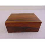 A rectangular mahogany humidor with hinged cover