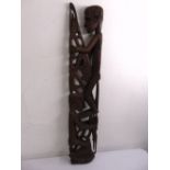 An West African carved wooden sculpture of two figures, 105cm (h)