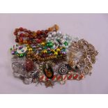 A quantity of costume jewellery to include necklaces, rings, bracelets, brooches and earrings