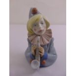 A Lladro figurine of a clown playing a saxophone serial no. 5586