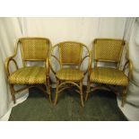 A pair of Bentwood chairs with rattan seats and another