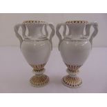 A pair of Meissen classical style vases of baluster form with serpent side handles on raised