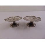 A pair of silver bonbon dishes, circular pierced on raised circular bases, Birmingham 1955