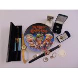 A quantity of entertainment collectables to include watches, a ring, a bookmark and a Muppet Xmas