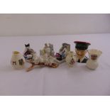 A quantity of porcelain collectables to include Goss crested porcelain, Capodimonte birds and a