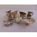A quantity of silver plate to include dishes, sugar bowls, milk jugs and a mug (9)