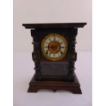 A mahogany and glass mantle clock with gilded metal dial, two train movement to include pendulum