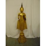 A Thai gilt bronze standing Buddha on stepped and raised octagonal base, 133cm (h)