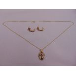 9ct diamond and pink sapphire pendant on a 9ct gold chain and a pair of matching earrings, approx