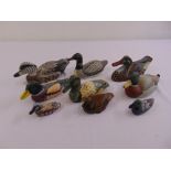 A quantity of porcelain and wooden duck figurines (9)