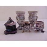 A quantity of Edward Moore Victorian amethyst glassware to include a pair of Griffin and Chain