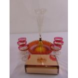 A Victorian coloured glass epergne of circular crimped form supporting a clear glass vase, six 1950s