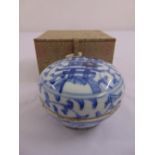 A Chinese blue and white compressed spherical dish and cover decorated with leaves and scrolls,