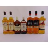 Seven bottle of Scotch whisky to include two Bells litres, two Whyte & Mackay litres, one The Famous